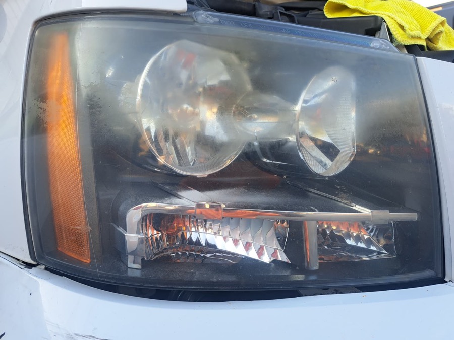 Truck headlight before restoration, hazy and oxidized